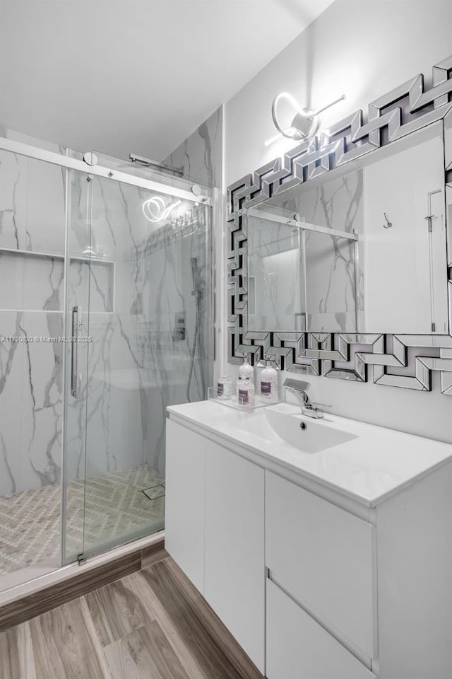 181 SW 76th Ter, Margate, FL 33068 - full bath with wood finished floors, vanity, and a marble finish shower