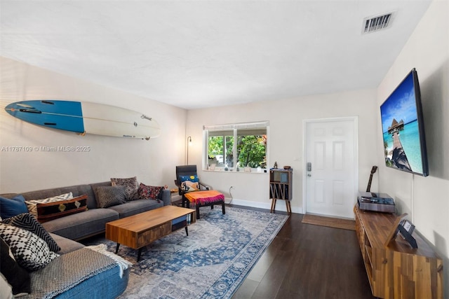 11105 NE 9th Ave, Biscayne Park, FL 33161 - living area with visible vents, baseboards, and wood finished floors
