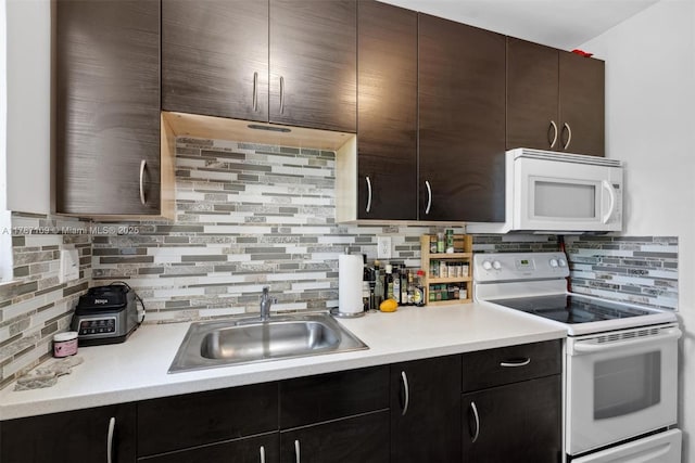 11105 NE 9th Ave, Biscayne Park, FL 33161 - kitchen with white appliances, decorative backsplash, a sink, and light countertops