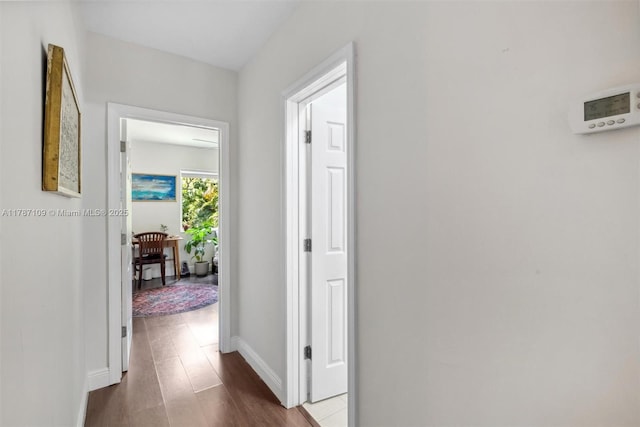 11105 NE 9th Ave, Biscayne Park, FL 33161 - hallway with baseboards and dark wood finished floors