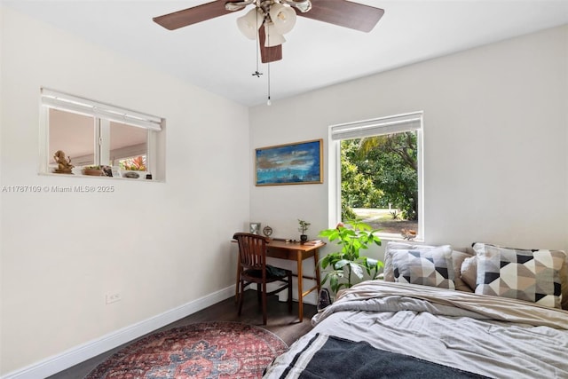 11105 NE 9th Ave, Biscayne Park, FL 33161 - bedroom with a ceiling fan, baseboards, and wood finished floors