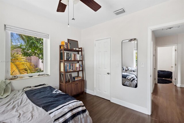 11105 NE 9th Ave, Biscayne Park, FL 33161 - bedroom with visible vents, baseboards, ceiling fan, and wood finished floors