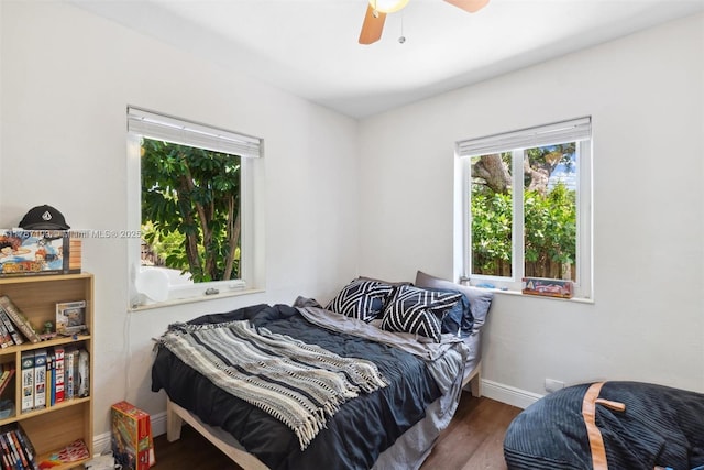 11105 NE 9th Ave, Biscayne Park, FL 33161 - bedroom with baseboards, ceiling fan, and wood finished floors