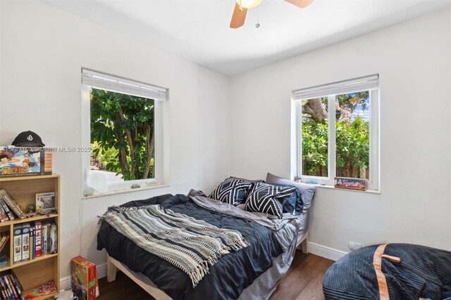 11105 NE 9th Ave, Biscayne Park, FL 33161 - bedroom with baseboards, ceiling fan, and wood finished floors