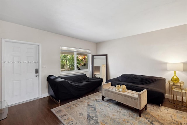 11105 NE 9th Ave, Biscayne Park, FL 33161 - living room featuring baseboards and wood finished floors