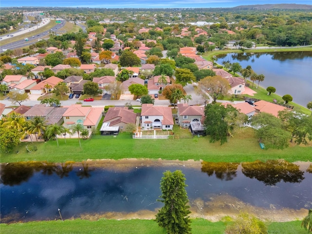 aerial view featuring a residential view and a water view