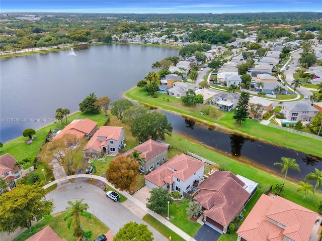 birds eye view of property featuring a residential view and a water view