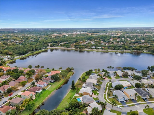 bird's eye view featuring a water view and a residential view