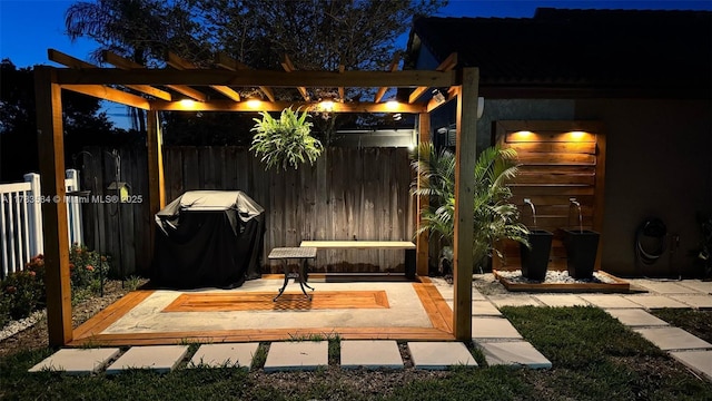 view of patio / terrace with fence, area for grilling, and a pergola