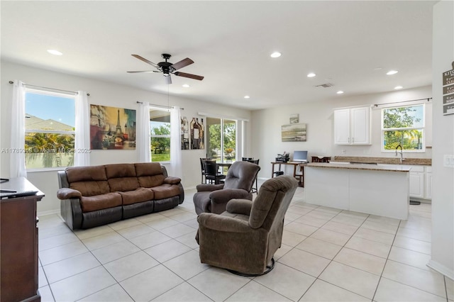 10860 79th St, E, FL 34219 - living area featuring a healthy amount of sunlight, recessed lighting, light tile patterned floors, and ceiling fan