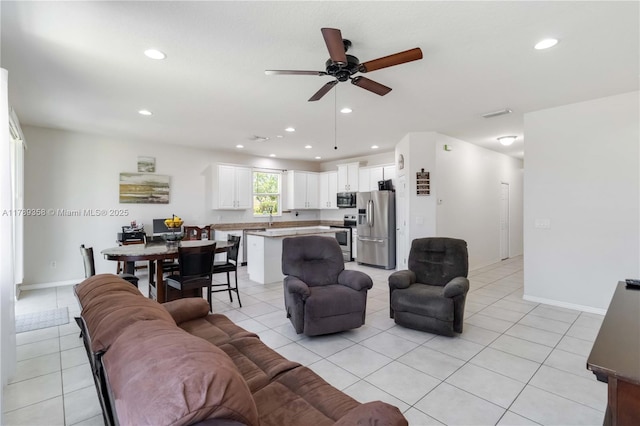 10860 79th St, E, FL 34219 - living room featuring baseboards, recessed lighting, a ceiling fan, and light tile patterned flooring