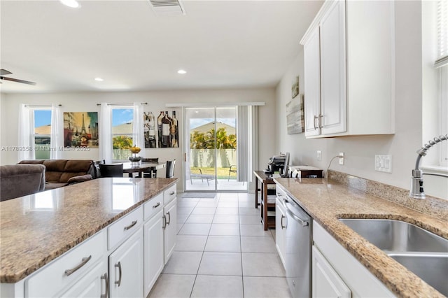 10860 79th St, E, FL 34219 - kitchen featuring a sink, visible vents, white cabinetry, stainless steel dishwasher, and open floor plan