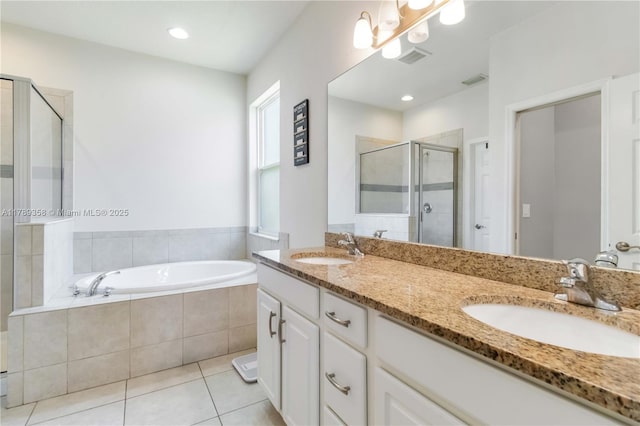 10860 79th St, E, FL 34219 - full bathroom with tile patterned floors, a shower stall, a bath, and a sink