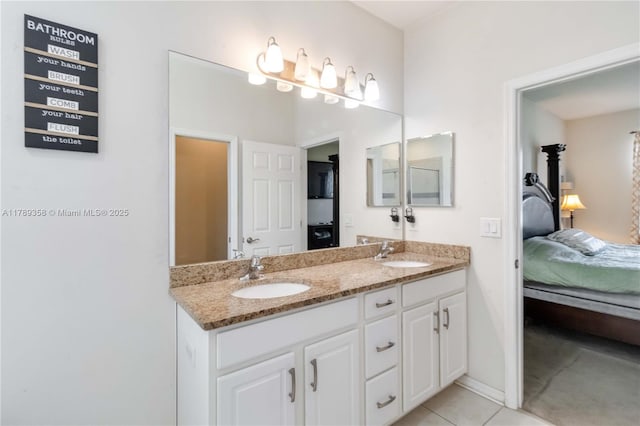 10860 79th St, E, FL 34219 - ensuite bathroom with connected bathroom, tile patterned flooring, double vanity, and a sink