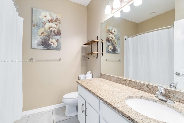 10860 79th St, E, FL 34219 - bathroom with toilet, vanity, tile patterned flooring, and baseboards