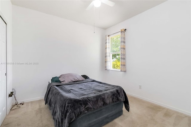 10860 79th St, E, FL 34219 - bedroom featuring a ceiling fan, light colored carpet, and baseboards
