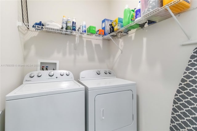 10860 79th St, E, FL 34219 - clothes washing area featuring separate washer and dryer and laundry area