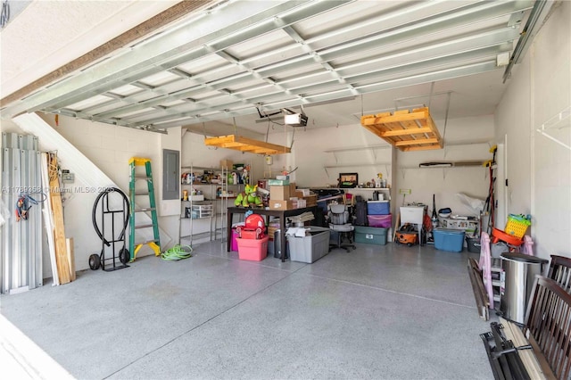 10860 79th St, E, FL 34219 - garage with a garage door opener and electric panel
