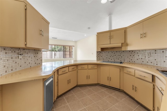 kitchen featuring light tile patterned floors, backsplash, and light countertops