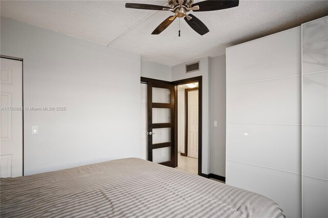 901 S Surf Rd Unit 603, Hollywood, FL 33019 - unfurnished bedroom with a textured ceiling, visible vents, and ceiling fan