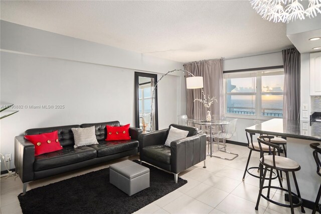 901 S Surf Rd Unit 603, Hollywood, FL 33019 - living room with light tile patterned flooring and a chandelier