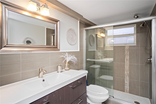 901 S Surf Rd Unit 603, Hollywood, FL 33019 - full bathroom with vanity, a stall shower, toilet, and tile walls