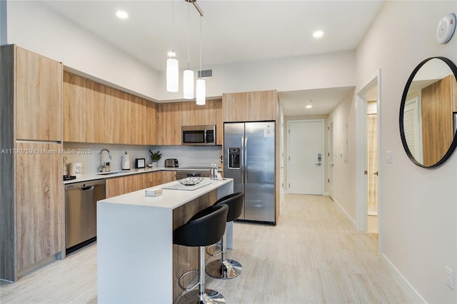 3900 Biscayne Blvd Unit N-821, Miami, FL 33137 - kitchen featuring light countertops, modern cabinets, appliances with stainless steel finishes, and a sink