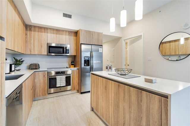 3900 Biscayne Blvd Unit N-821, Miami, FL 33137 - kitchen with modern cabinets, light countertops, stainless steel appliances, and visible vents