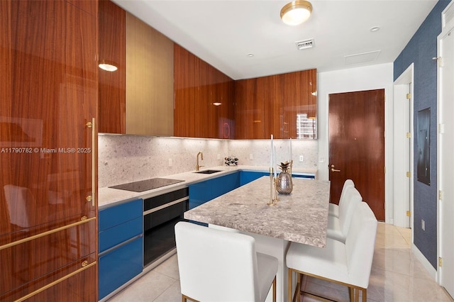 2655 S Bayshore Dr Unit 1006, Coconut Grove, FL 33133 - kitchen with a sink, modern cabinets, light tile patterned flooring, black electric stovetop, and visible vents