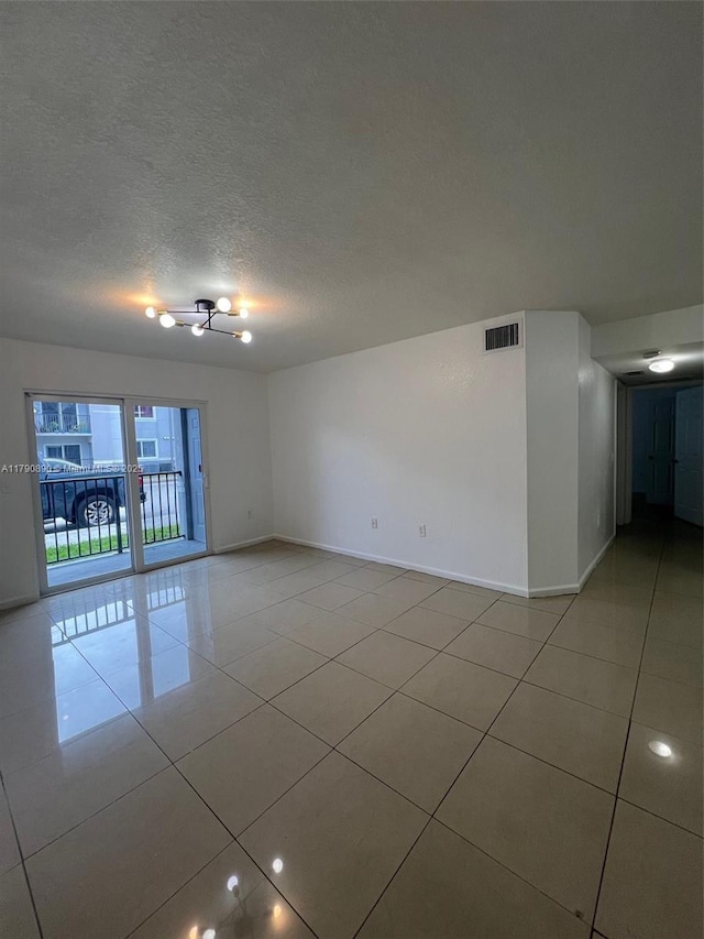 15422 SW 284th St Unit 7104, Homestead, FL 33033 - spare room with light tile patterned floors and a textured ceiling