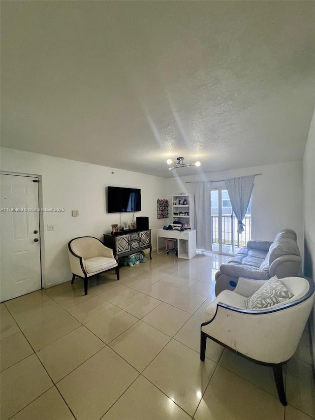 living room with light tile patterned floors and a textured ceiling