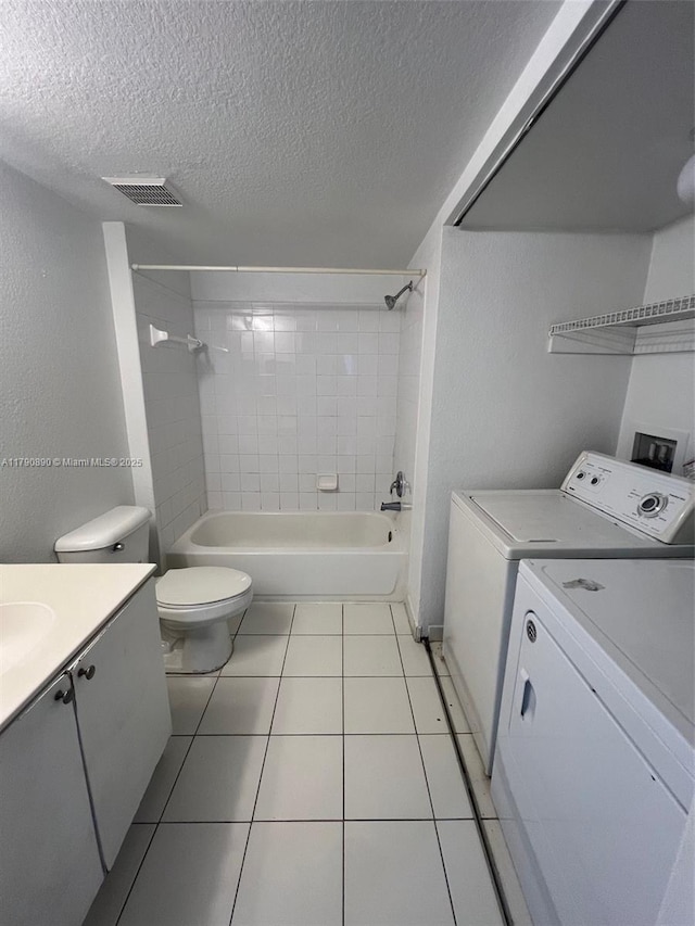 15422 SW 284th St Unit 7104, Homestead, FL 33033 - full bathroom featuring washing machine and clothes dryer, a textured ceiling, vanity, bathtub / shower combination, and tile patterned floors