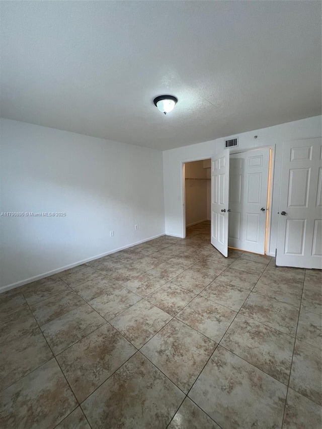 15422 SW 284th St Unit 7104, Homestead, FL 33033 - unfurnished bedroom with a closet and tile patterned floors