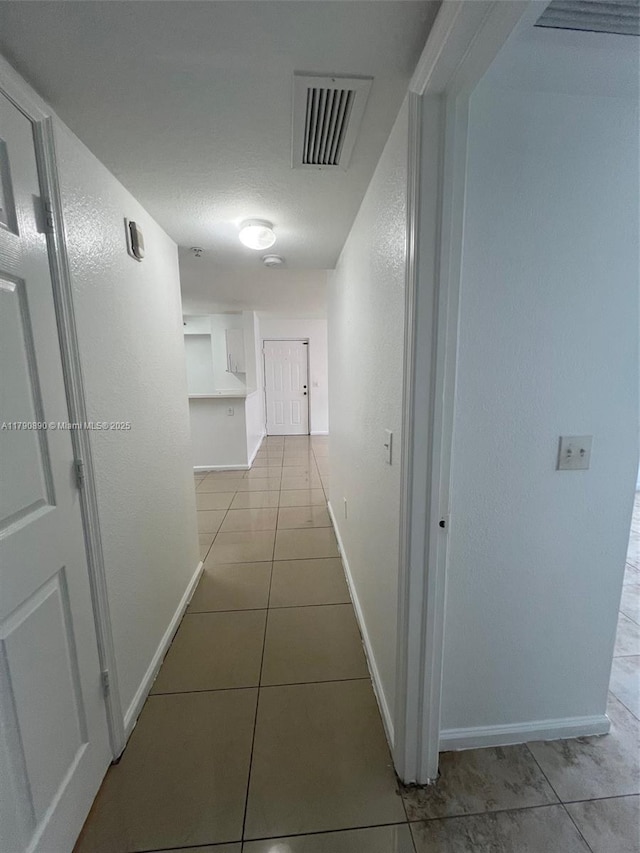 15422 SW 284th St Unit 7104, Homestead, FL 33033 - hallway featuring tile patterned flooring and a textured wall
