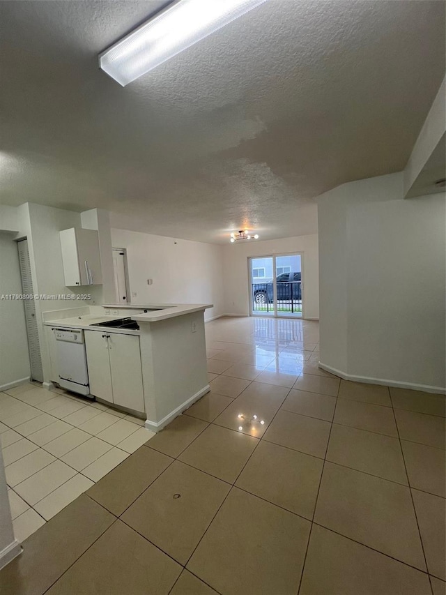 15422 SW 284th St Unit 7104, Homestead, FL 33033 - kitchen with a textured ceiling, white dishwasher, white cabinetry, and light tile patterned floors