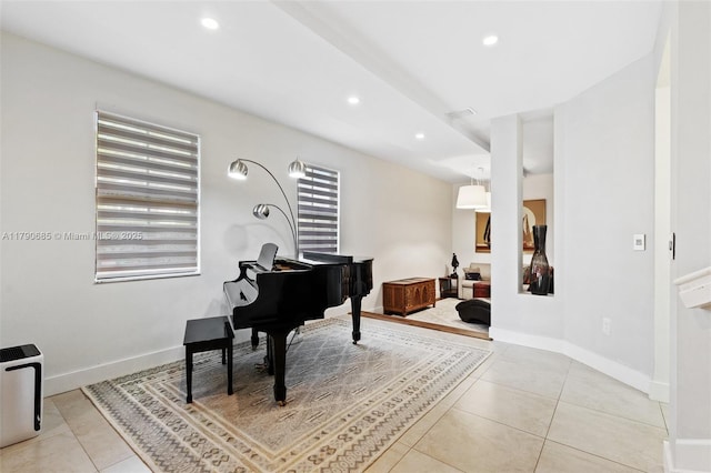 sitting room featuring light tile patterned flooring, recessed lighting, and baseboards