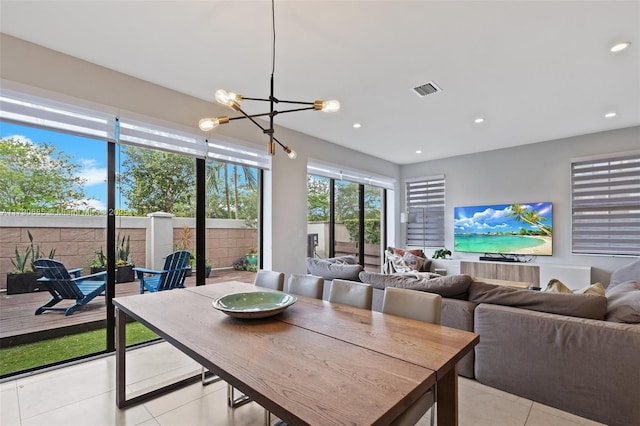 dining area with an inviting chandelier, light tile patterned floors, visible vents, and recessed lighting
