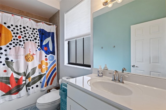 full bath featuring toilet and vanity