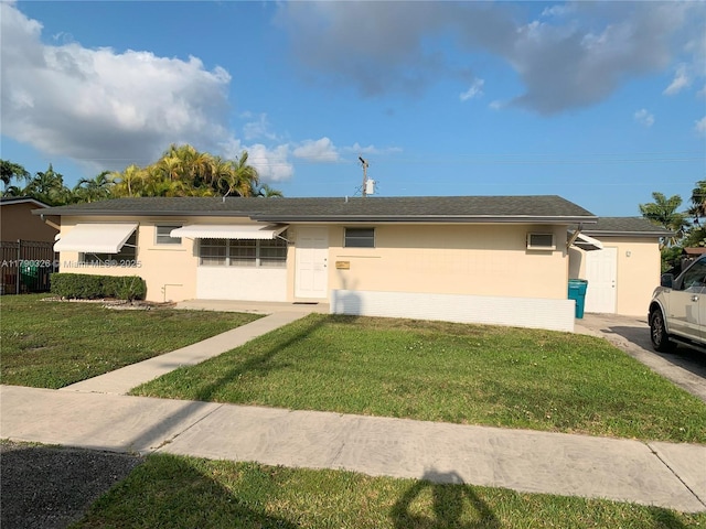 single story home with stucco siding and a front lawn