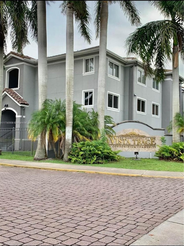 view of building exterior featuring fence