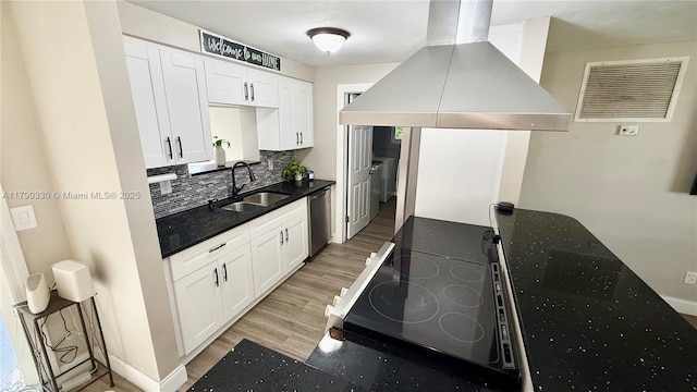 kitchen featuring decorative backsplash, a sink, visible vents, dishwasher, and island exhaust hood