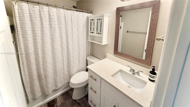 full bath with toilet, shower / bath combo, and vanity