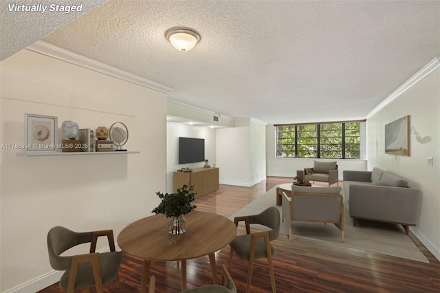 3100 NW 42nd Ave Unit D202, Coconut Creek, FL 33066 - dining room with crown molding, a textured ceiling, and wood finished floors