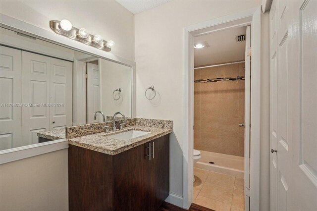 3100 NW 42nd Ave Unit D202, Coconut Creek, FL 33066 - full bath with vanity, a shower stall, and tile patterned floors