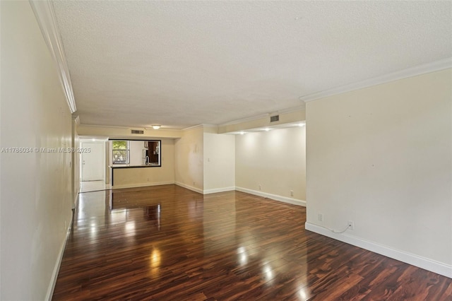 3100 NW 42nd Ave Unit D202, Coconut Creek, FL 33066 - unfurnished room featuring crown molding, a textured ceiling, and wood finished floors
