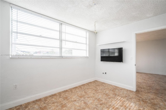 7850 Byron Ave Unit 207, Miami Beach, FL 33141 - empty room with a textured ceiling and baseboards
