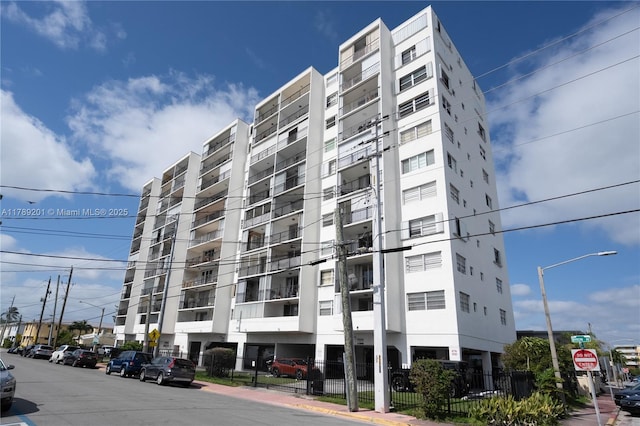 7850 Byron Ave Unit 207, Miami Beach, FL 33141 - view of apartment building / complex featuring fence
