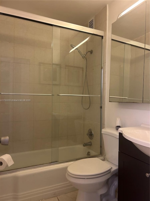 2451 Brickell Ave Unit 4P, Miami, FL 33129 - bathroom with toilet, vanity, and shower / bath combination with glass door