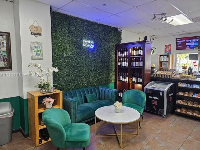 2451 Brickell Ave Unit 4P, Miami, FL 33129 - living area with a paneled ceiling and tile patterned floors