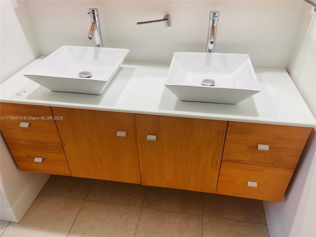 interior space with tile patterned floors and a sink